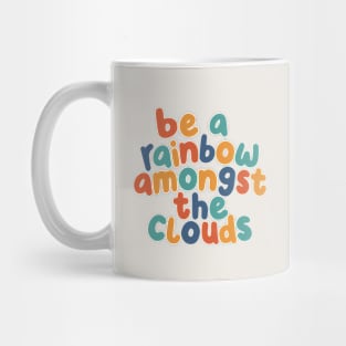 Be a Rainbow Amongst the Clouds by The Motivated Type Mug